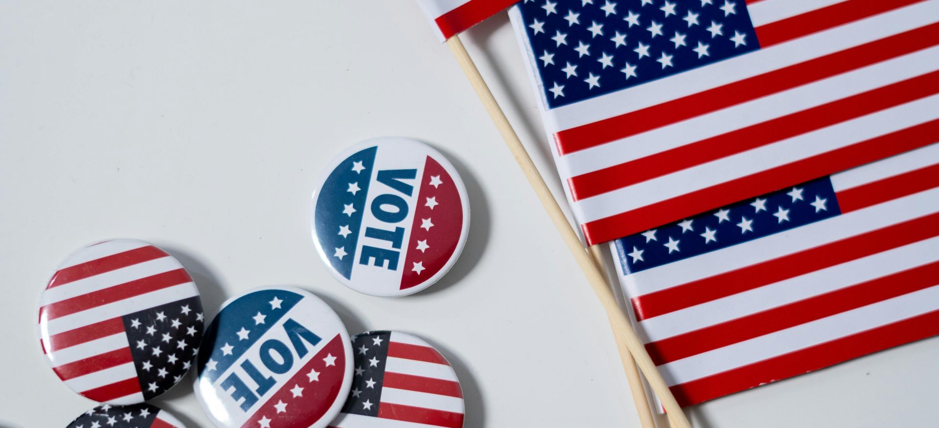 American Flags and Pins on White Background